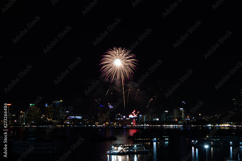 PATTAYA, THAILAND - MAY24: Beautiful lights on the night, colorful fireworks, and International fireworks at Pattaya International Fireworks Festival 2019 on May 24,2019 in Pattaya,Thailand. PATTAYA, THAILAND - MAY24: Beautiful lights on the night, colorful fireworks, and International fireworks at Pattaya International Fireworks Festival 2019 on May 24,2019 in Pattaya,Thailand.