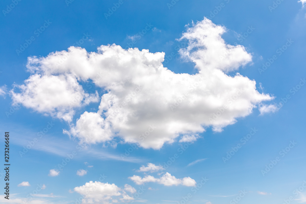 Obraz premium Deep blue sunny sky with white clouds. Blue sky with cloud closeup. White fluffy clouds in the blue sky.