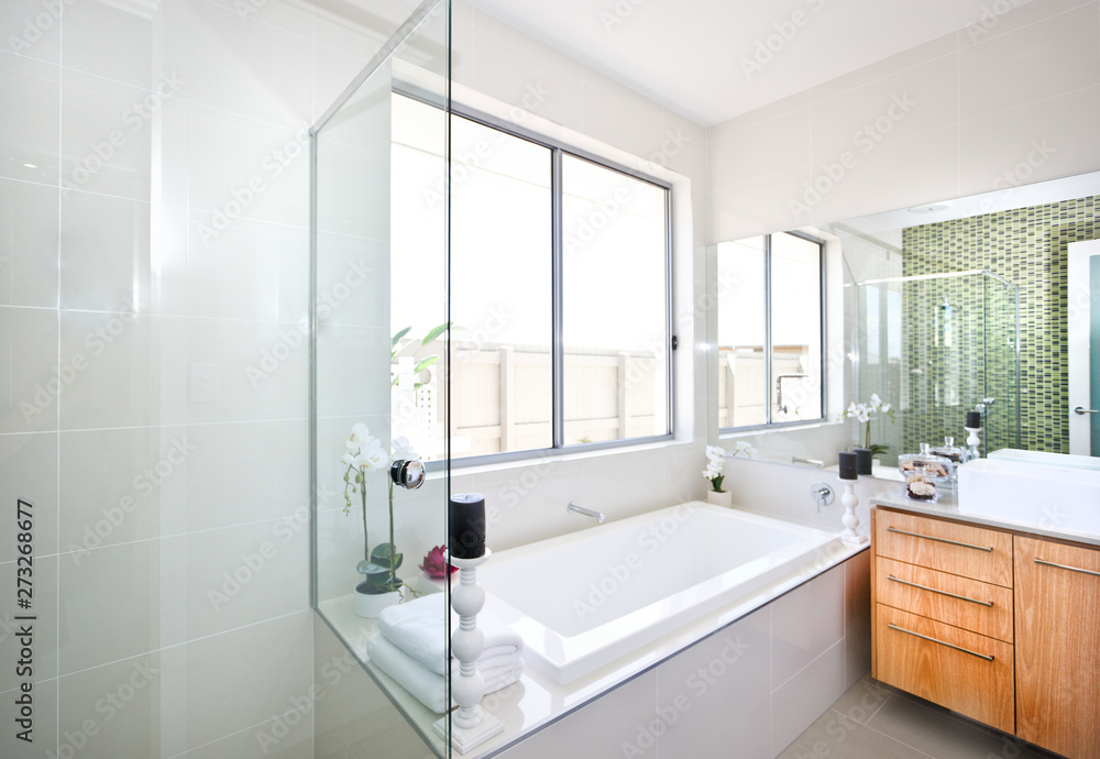 Modern bathroom focusing on bathtub in a luxurious hotel Modern bathroom focusing on bathtub in a luxurious hotel