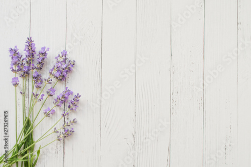 Composition of lavender on white wooden background. Violet summer flowers. Free space