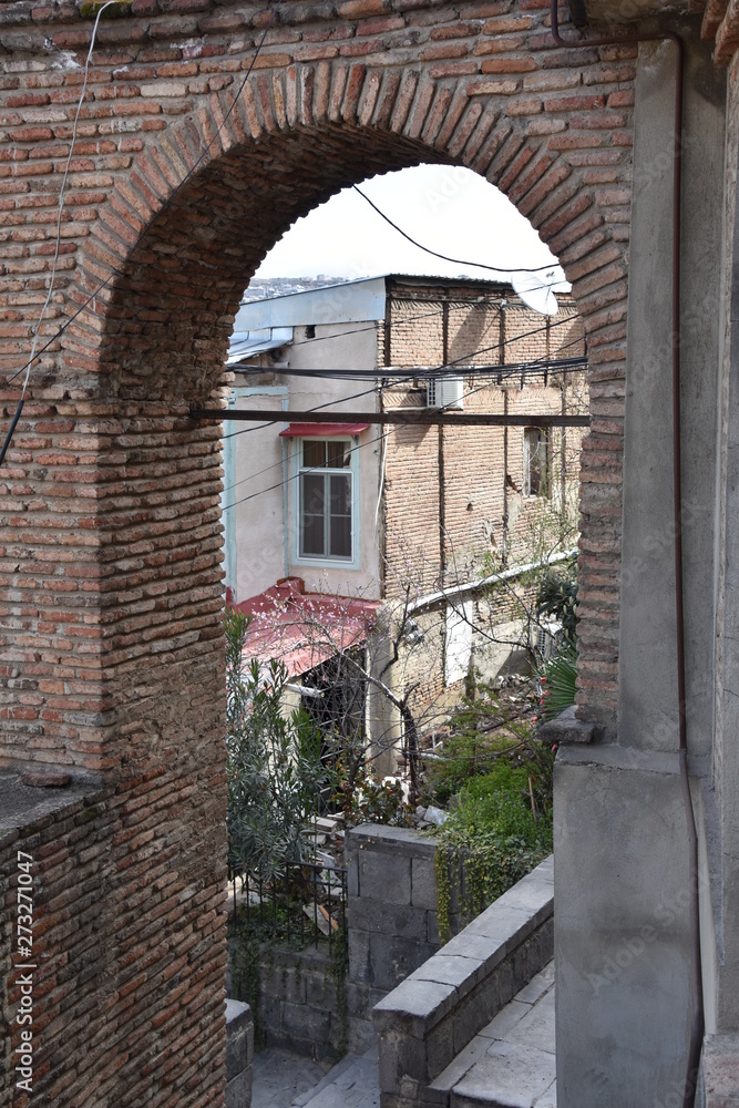 Fototapeta premium Looking Down Through Brick Arch, Betlemi Rise, Tbilisi, Georgia