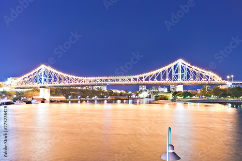 River and a long bridge in the city at night