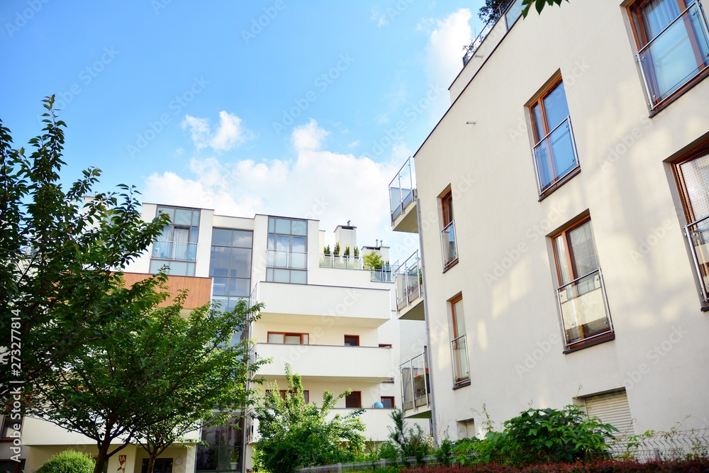 Fototapeta premium Multistory new modern apartment building. Stylish living block of flats.