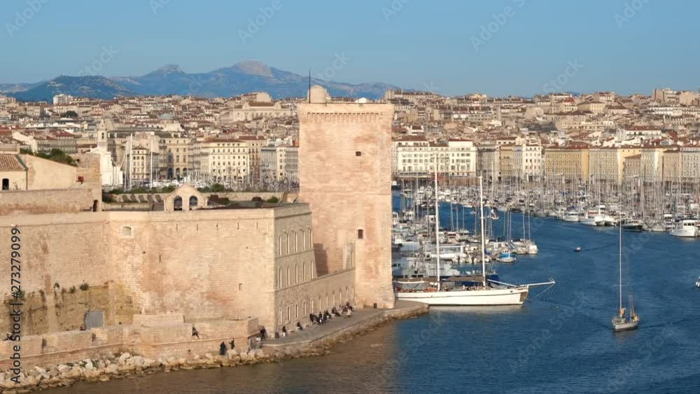 Yachts coming to Marseille Old Port on sunset. Marseille, France Yachts coming to Marseille Old Port on sunset. Marseille, France