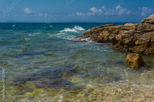 Waves breaking on a stony beach in Murter  Croatia  Dalmatia
