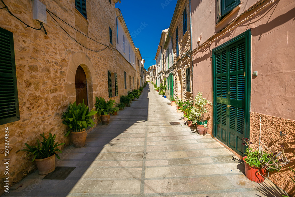 Narrow street in old town of  historic Alcudia. Majorca. Spain.