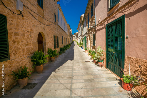 Narrow street in old town of historic Alcudia. Majorca. Spain.