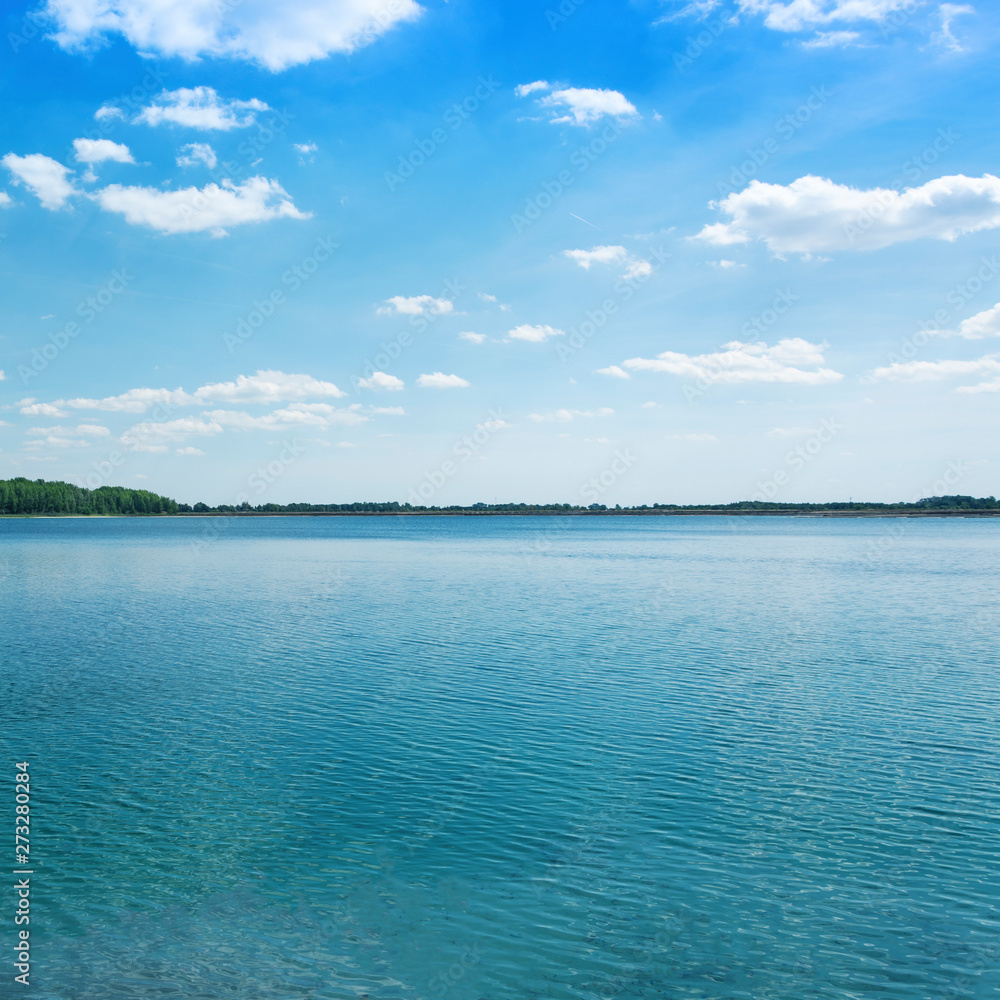 horizopntal landscape of blue lake summer time quadrat