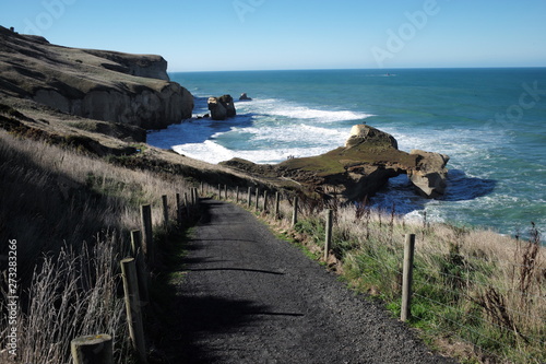 local road go tothe sea and blue sky background photo