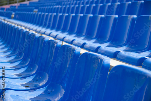 empty spectator seats in the open-air arena