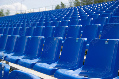 empty spectator seats in the open-air arena