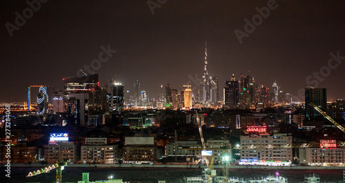 Wallpaper Mural Dubai Downtown nightsky with Burj Khalifa and other towers view from the top in Dubai, United Arab Emirates. Night scene with lighten city. Torontodigital.ca