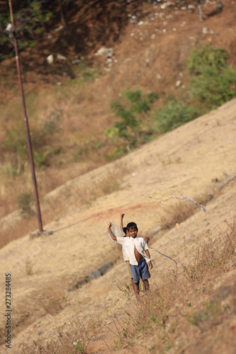 indian child playing with kite