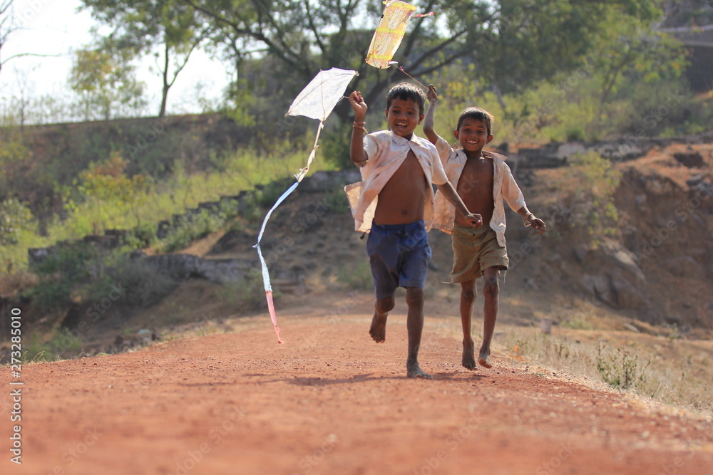 Fototapeta premium indian child playing with kite