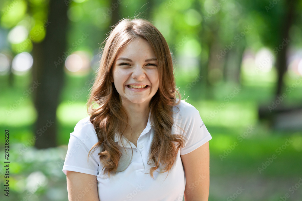 Outdoors portrait of beautiful young brunette girl. Outdoors portrait of beautiful young brunette girl.
