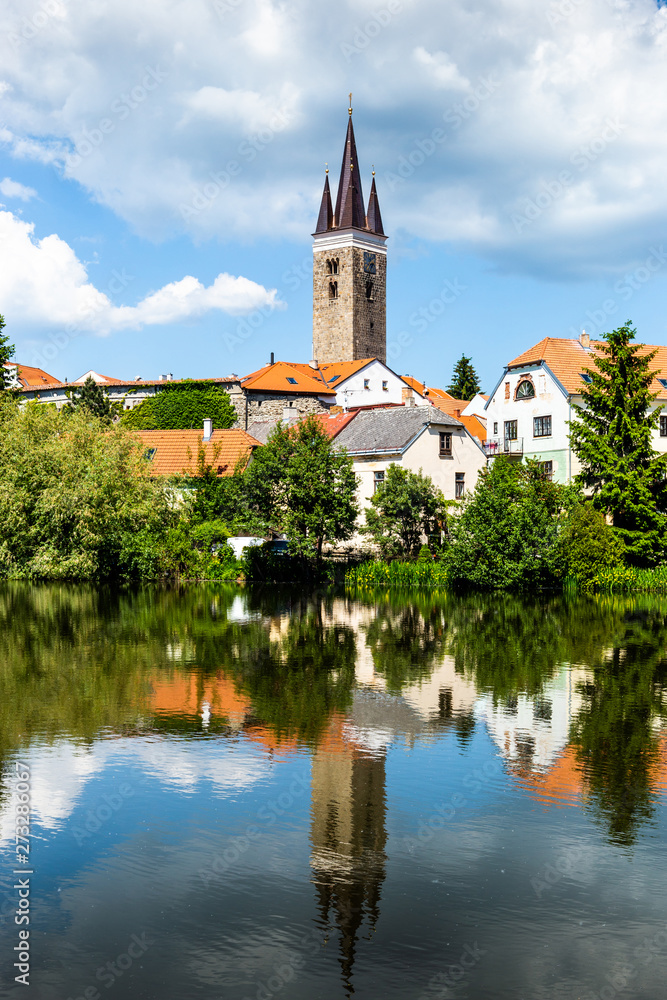 View of Telc across pond with reflections, Unesco world heritage site, South Moravia, Czech Republic.