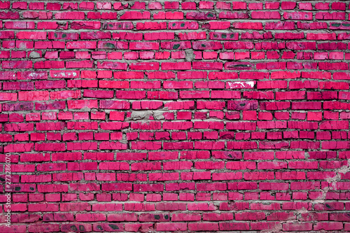 Obraz na płótnie A old brick wall with cracks. Abstract background. Toned. Texture