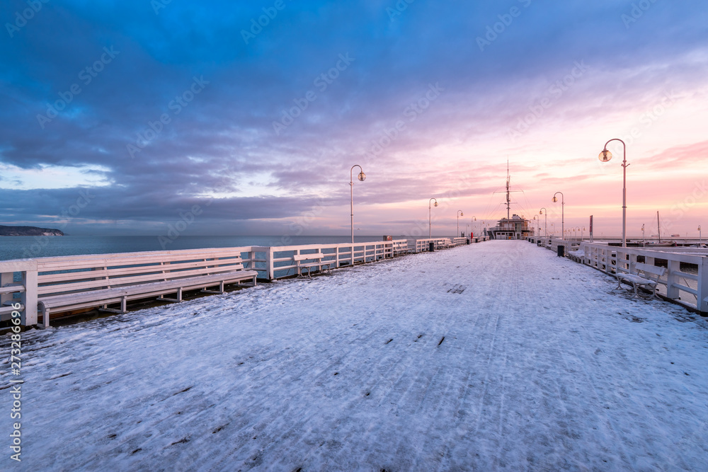 Snow covered pier in Sopot. Winter landscape. Poland.