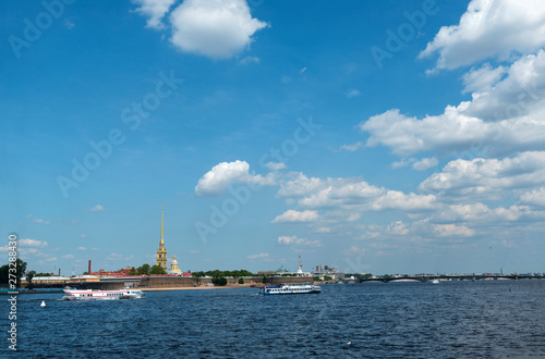 boats on the Neva river on a Sunny day, view of the Peter and Paul fortress in St. Petersburg