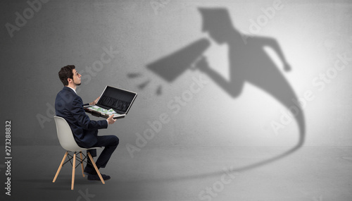 Canvas Print Small businessman staying and offering stuffs to his bossy yelling shadow