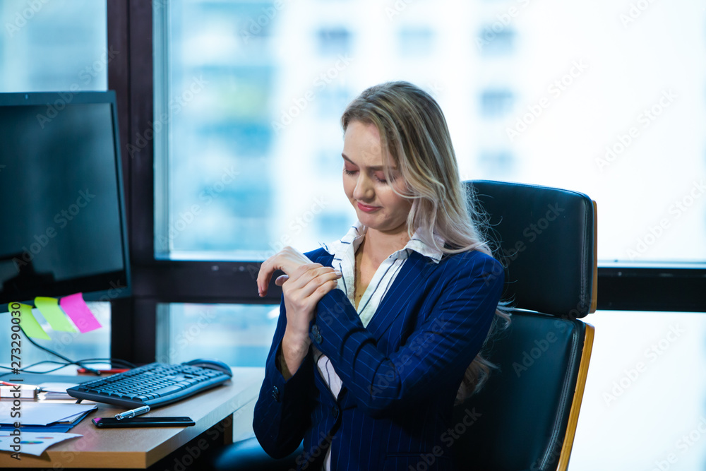 Business Woman holding her wrist pain from using computer. Office syndrome Business Woman holding her wrist pain from using computer. Office syndrome