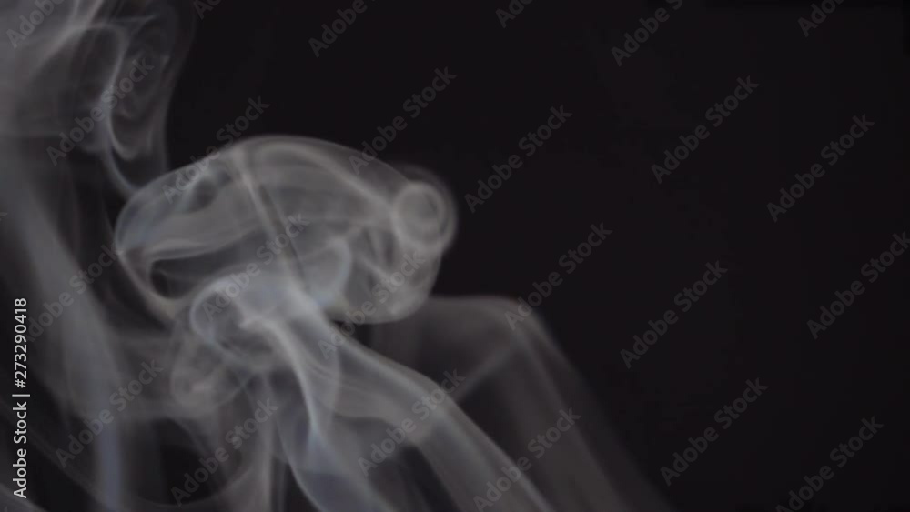Magic real smoke slowly floating and rolling against black background. Abstract foggy and haze texture. Closeup slow motion shot. Shooting with high-speed camera. Magic real smoke slowly floating and rolling against black background. Abstract foggy and haze texture. Closeup slow motion shot. Shooting with high-speed camera.