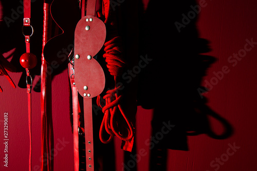 erotic games and human sexuality concept. kinky sex toys for  BDSM fantasy play (ball gag, cuffs, rope, flogger, collar and leash)