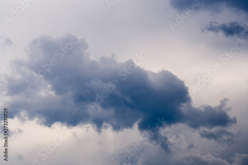 Big cumulonimbus on blue sky. Cumulus, stratocumulus, stratus, altocumulus, nimbostratus. Dramatic sky with stormy clouds © Sergey