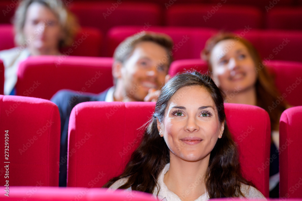 young woman watching a movie alone young woman watching a movie alone