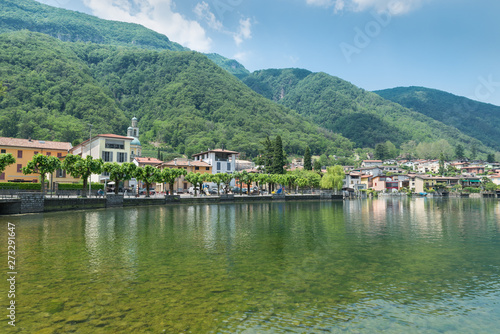 Tourist town on the lake of Lugano; Riva San Vitale in summer, Switzerland, at the foot of Monte San Giorgio. Monte San Giorgio is a UNESCO site for the important fossiliferous deposits 