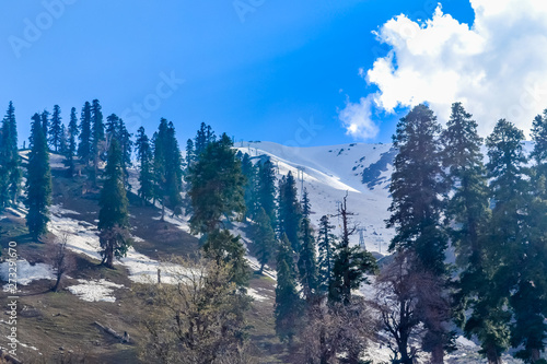 Stunning photograph of Kashmir also called 'Paradise on Earth', the most picturesque part of India, turns into a snowy wonderland just before winter in Gulmarg, a popular tourist attraction. photo