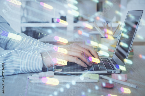 Businessman working on Laptop with technology theme drawing. Concept of big data. Double exposure.