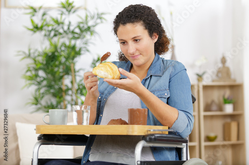 lady in wheelchair making sandwiches for breakfast