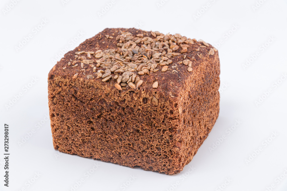 Rustic homemade bread with sunflowers seeds on top. White background Rustic homemade bread with sunflowers seeds on top. White background