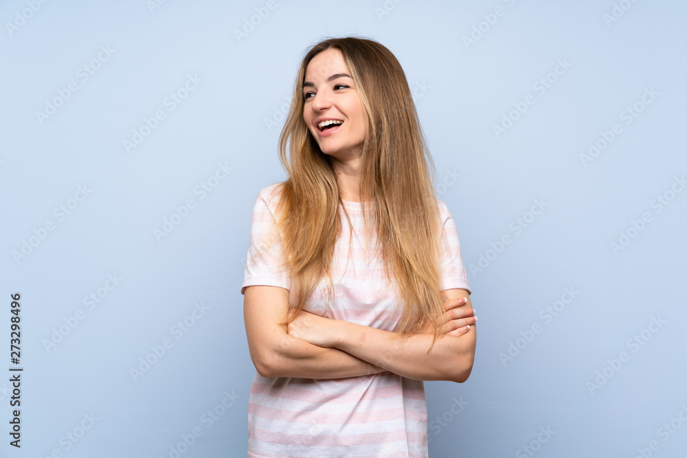 Young woman over isolated blue background happy and smiling Young woman over isolated blue background happy and smiling