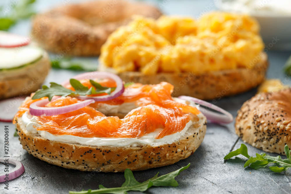 Healthy Bagels breakfast sandwich with salmon, scrambled eggs, vegetables and cream cheese Healthy Bagels breakfast sandwich with salmon, scrambled eggs, vegetables and cream cheese