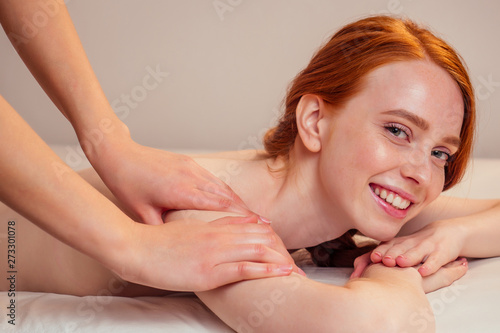 Woman having massage in the spa salon