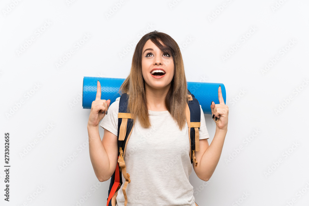 Young traveler woman over white background pointing up a great idea Young traveler woman over white background pointing up a great idea