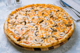 pizza with mushrooms on board