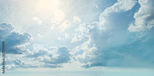 Blue sky clouds background. Beautiful landscape with clouds and sun