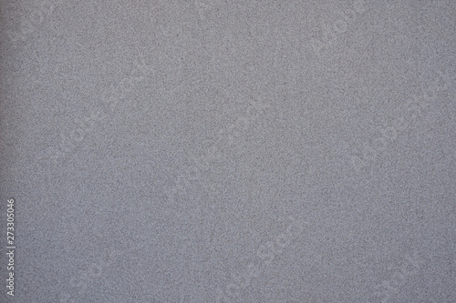 Background wall with concrete chips. Concrete wall with a fine crumb. The texture of the concrete wall.