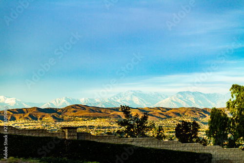 Snow capped mountains above the hills of Anaheim California.