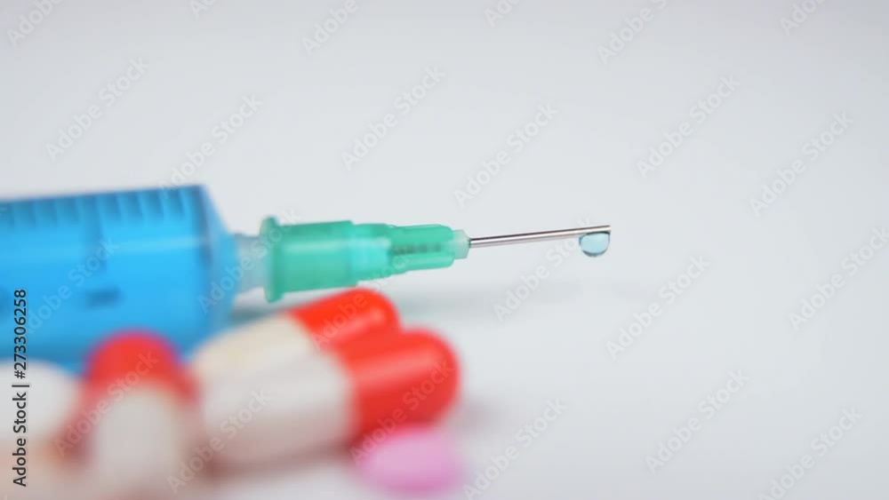A blurred background getting out of focus as a medical concept with pills and capsules. Focus in and out. A blurred background getting out of focus as a medical concept with pills and capsules. Focus in and out.