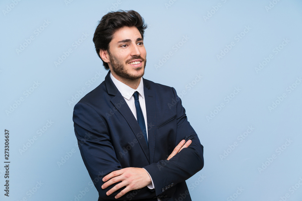 Businessman over isolated blue wall happy and smiling Businessman over isolated blue wall happy and smiling