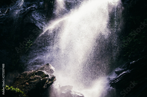 The water spray from the waterfall closeup