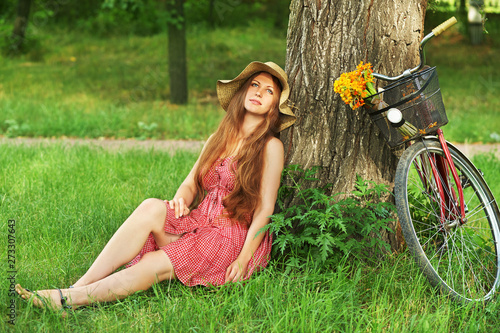 Young woman and bike © bakharev