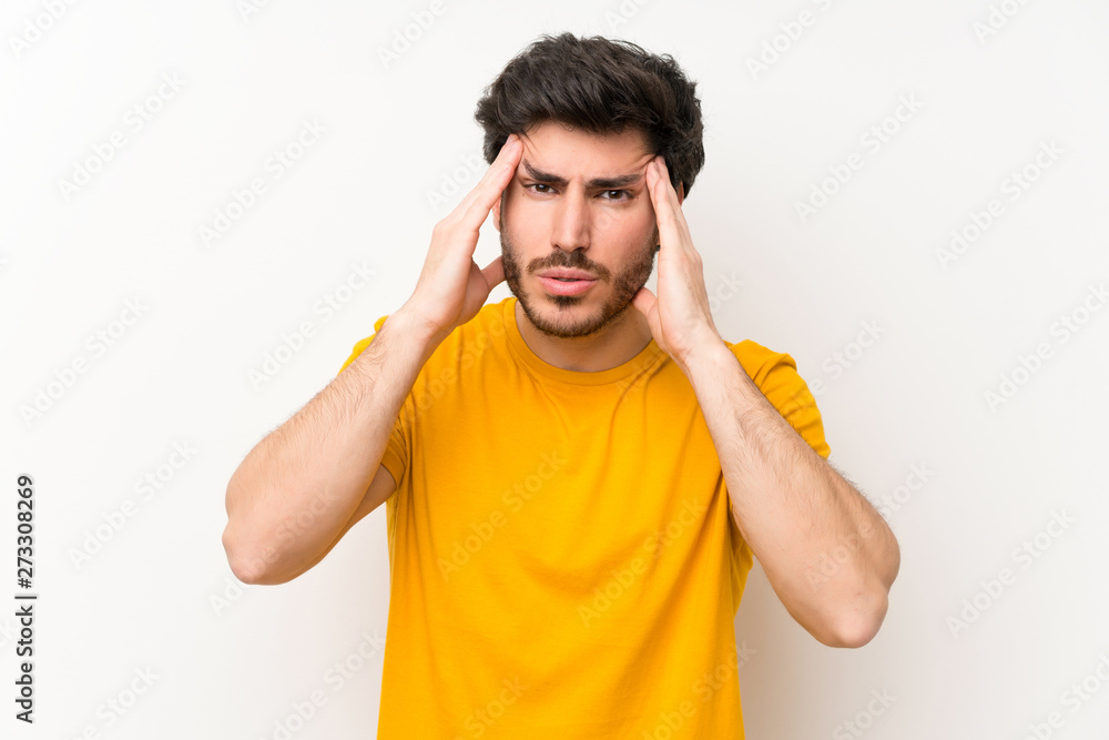 Handsome over isolated white wall unhappy and frustrated with something. Negative facial expression Handsome over isolated white wall unhappy and frustrated with something. Negative facial expression