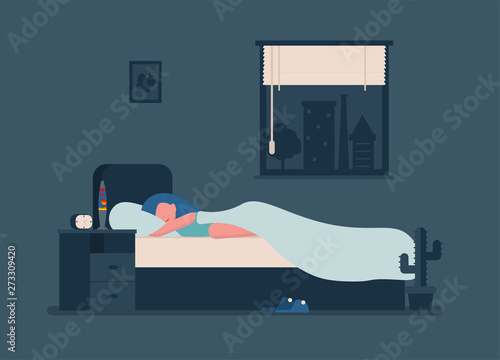 Happy young girl sleeping in her room in bed at night.