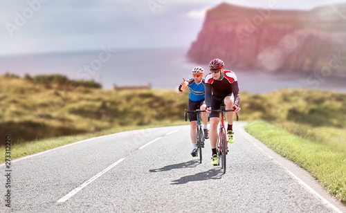 Canvastavla Cyclists out racing along country lanes near the coast in the United Kingdom