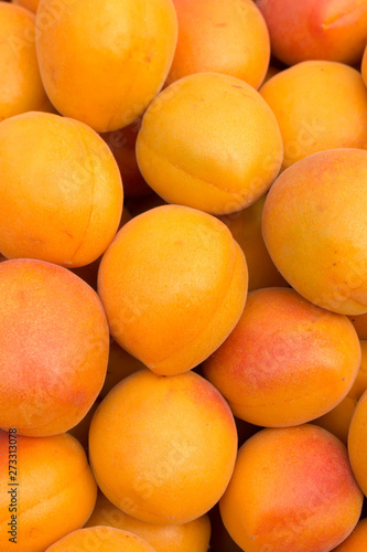 Ripe apricots on the market. Background of apricots close-up.